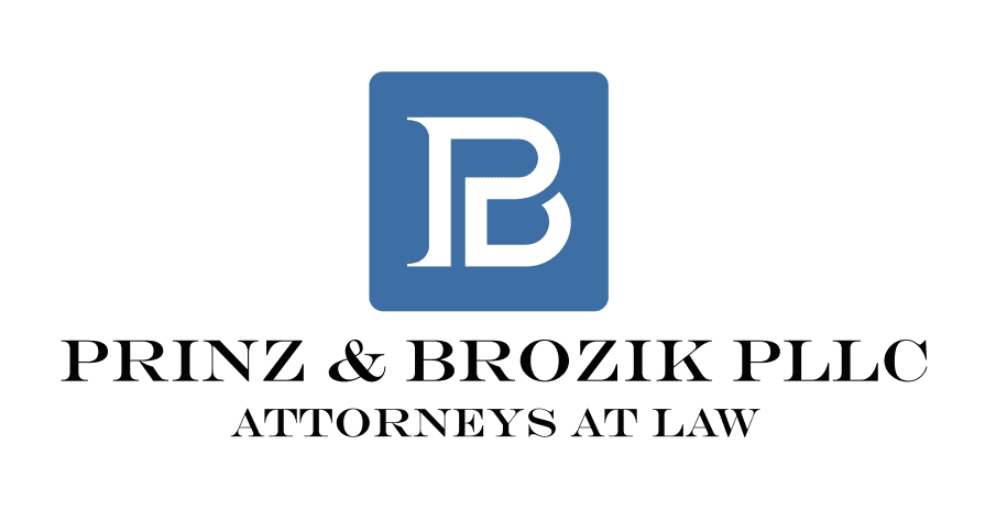 A blue and white logo of the law office of franz & brozik llp.