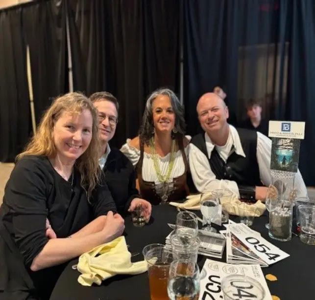 A group of people sitting at a table.